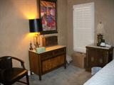 Marble top small dresser with nice abstract oil above it. One of a pair of nice marble top night stands.