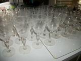 Crystal stemware from kitchen cabinet (pattern and maker unknown). Green to clear boopies not show but two sets (sherbets and water)