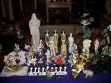 Table full of all types of figurines and Menorahs. ,,Boehm, Austin, oriental, A. Zach figures, marble David bust, etc
