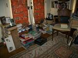 stacks of books on Den floor