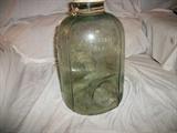 This is a "Camp Minnow Trap" from Checotach, Oklahoma and is so marked in embossed glass. We estimate it is from the 1920s-40s era. It is tinted green from spending time in the water. It has three entries for the minnows to use and is in good shape without cracks or chips except on the lip of the jar mouth which is generally covered by the mason jar type lid. It is approximately 6 inches in diameter and about 11 inches tall.