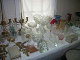 Table full of great glass pieces including wonderful cut glass punch bowl, Heisey Horse Head, several decanturs, some elegant glassware and much more