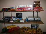 LARGE COLLECTION OF DIE CAST TRUCKS, CARS, EQUIPMENT, COLLECTION OF UPS TRUCKS, TRANS CON, COCA COLA, STRUCTO TRUCKS, LOUIS MARX WIND UP TOY.