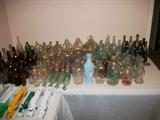 6 FOOT TABLE FULL OF BOTTLE COLLECTION. MILK BOTTLES, WHISKEY, DRUG, MEMPHIS, LARGE TO SMALL BOTTLES. GREEN, AMBER, CLEAR, BLUE.
