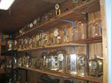 SHELVES FULL OF ANNIVERSARY
CLOCKS. 100'S OF CLOCKS.