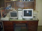 DESK FULL OF COMPUTER EQUIPMENT