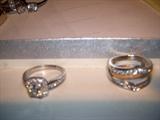 PLATINUM WEDDING RING APPROX 1 CARAT CENTER STONE 24 SMALL DIAMONDS.
14 KT WHITE GOLD RING GAURD 26 SMALL DIAMONDS.