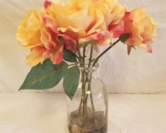 silk yellow roses in glass vase