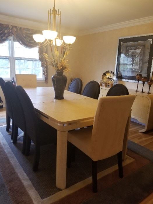 Dining room table and buffet. Fiberglass mesh overlay. Table with 2 leaves and 8 chairs.