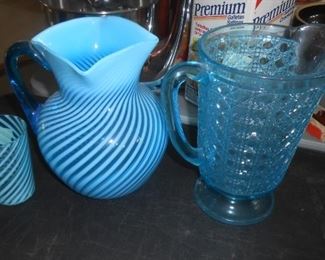 Swirl design pitcher with matching cup. Blue pitcher