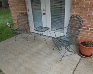 Metal patio captain chairs and side table