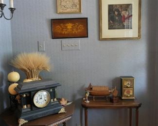 Mantle clock and assorted decorative items.