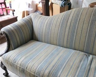 Camel back sofa with blue stripe upholstery. Carved cabriole feet. Vintage.