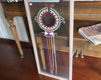 Interesting African beadwork necklace in glass frame