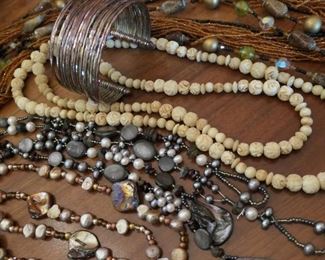 Bone and assorted stone necklaces.