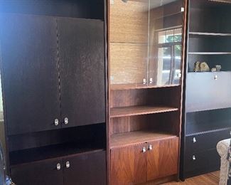 triple wall unit /middle unit sold separate...lighted display...other has drop down desk area/shelving