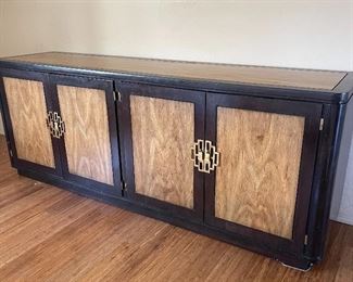 this credenza/side buffet is large with ample storage black with woods & Asian style hardware...Nice substantial period piece...adding measurements soon
