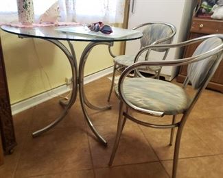 Chrome and Glass table and two chairs from the 80's/90's