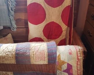 Quilts- in used condition but interesting- polka dots, the cigarette silk flags and a floral design on the other