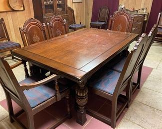 Jacobean Revival style dining set by John Stuart.  This  refectory table has two end leaves which slide under the main section    ...To Register and To Bid go to https://capitolsalesservices.hibid.com... 