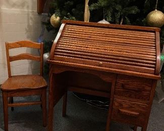 Old child's oak roll top desk and matching chair...To Register and To Bid go to https://capitolsalesservices.hibid.com... 