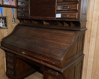 Antique style roll top desk made by  Mt Airy Furniture Company of Mt Airy, NC.  Solid oak wood construction in a dark stain finish.  ...To Register and To Bid go to https://capitolsalesservices.hibid.com... 