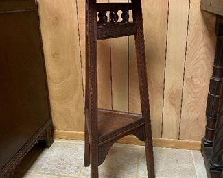 Antique tri-pod style plant stand with intricate carving detail ...To Register and To Bid go to https://capitolsalesservices.hibid.com... 
