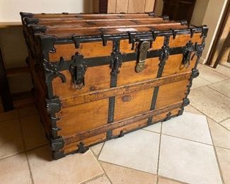 Antique flat top trunk...To Register and To Bid go to https://capitolsalesservices.hibid.com... 