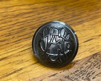 Vintage Western Electric metal employee coat button, one of several available. ...To Register and To Bid go to https://capitolsalesservices.hibid.com... 