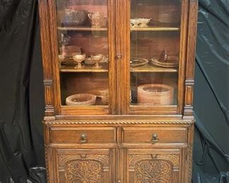 1930 Jacobean Revival style china cabinet from John Stuart which had show rooms in Grand Rapids, MI and New York city.   ...To Register and To Bid go to https://capitolsalesservices.hibid.com... 