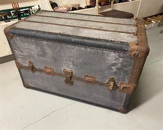 Antique steamer trunk...To Register and To Bid go to https://capitolsalesservices.hibid.com... 