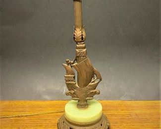 1920s table lamp with a stylized sailing ship base with slag glass.   (Photos by BC of Capitol Sales Services ) ...To Register and To Bid go to https://capitolsalesservices.hibid.com... 