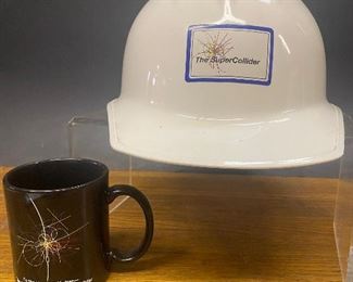 Coffee Cup and hard hat from the Texas Super Collider project that was cancelled in 1993 after several billion dollars had been spent on construction in Ellis County, TX   (Photos by BC of Capitol Sales Services ) ...To Register and To Bid go to https://capitolsalesservices.hibid.com... 