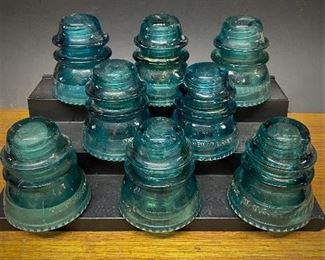 An assortment of Hemingray glass insulators ...To Register and To Bid go to https://capitolsalesservices.hibid.com... 