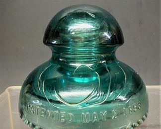 Hemingway 281  No 21 High Voltage triple  skirt green glass insulator with patent date of May 2, 1893  (Photos by BC of Capitol Sales Services ) ...To Register and To Bid go to https://capitolsalesservices.hibid.com... 