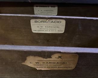Old Karwacki Pharmacy labels in a partitioned drawer.