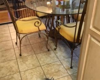 Glass & wrought iron table & chairs