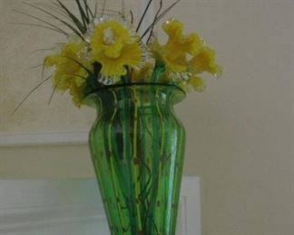 green glass vase with glass daffodils