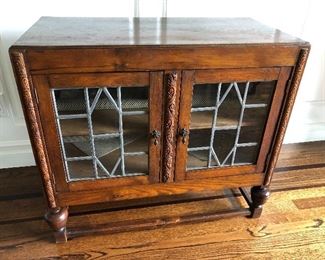 Antique low cabinet. $75.00 leaded glass panels .