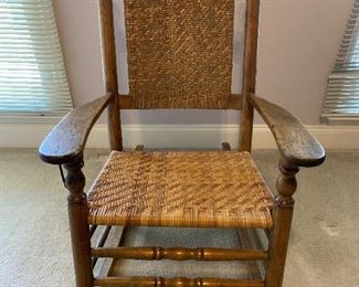 #29 Antique oak rocking chair with woven back $80.00