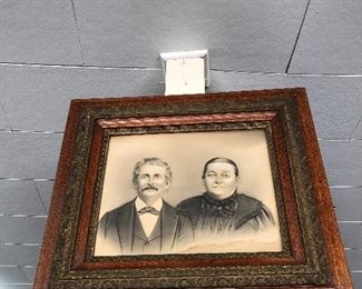 Family photo in ornate  wood frame 