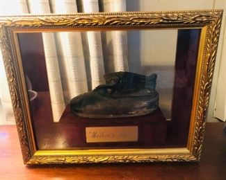 Mother’s shoe framed in a shadow box 
