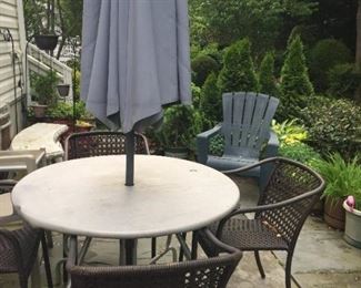 Patio table, chairs and umbrellas.