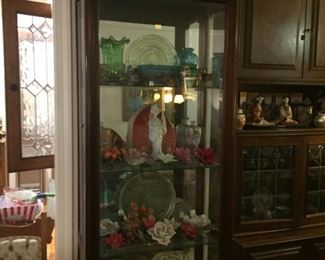 Collectibles in curio cabinet.