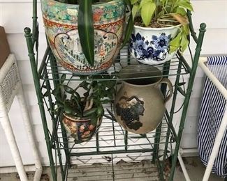 Metal rack with planted pots.