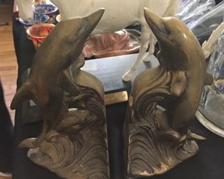 Brass dolphin bookends.
