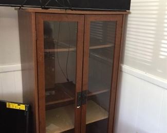 Glass cabinet and electronics.