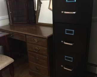 Metal filing cabinet and small desk.