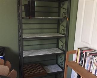Metal shelf with marble shelves.