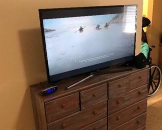Flat screen smart TV and dresser